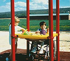 photo of children at ground-level component (sand table) that is part of a composite structure